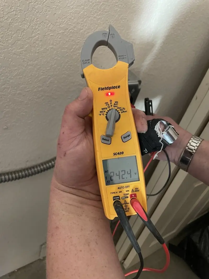 Voltage testing with clamp meter during Whole House Surge Protector in Fate